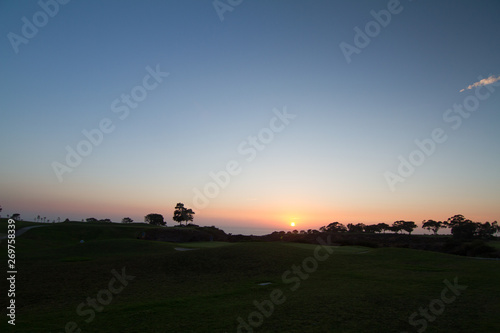 Afternoon setting sun over a beautiful Southern California golf course photo