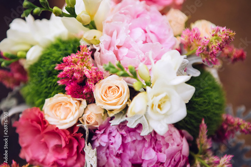 bouquet of flowers with roses  peonies  carnations. delicate bouquet in pink colors. eucalyptus leaves.