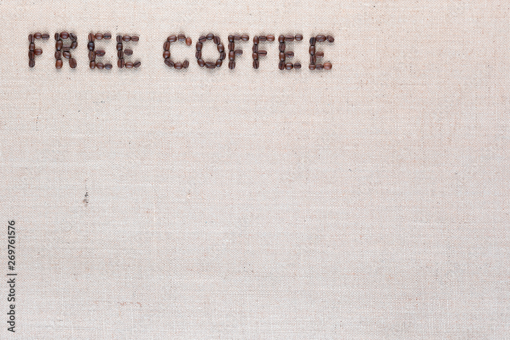 Free coffee words made of coffee beans on linen canvas, arranged top left