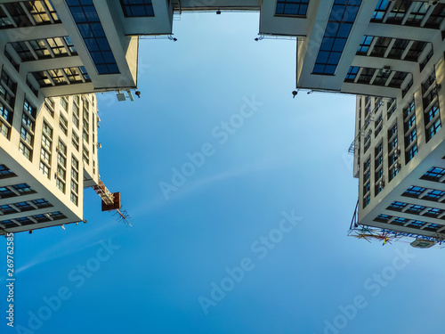 View up of State Industry Building or Gosprom built in Construction Art over blue sky photo