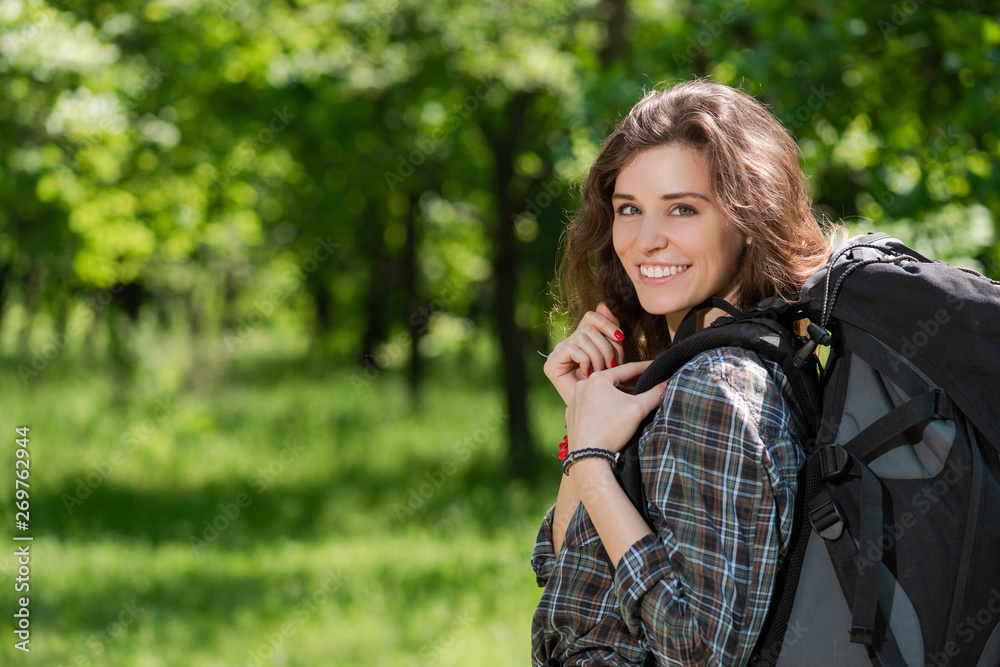 Happy tourist camper girl with backpack outdoors Happy tourist camper girl with backpack outdoors