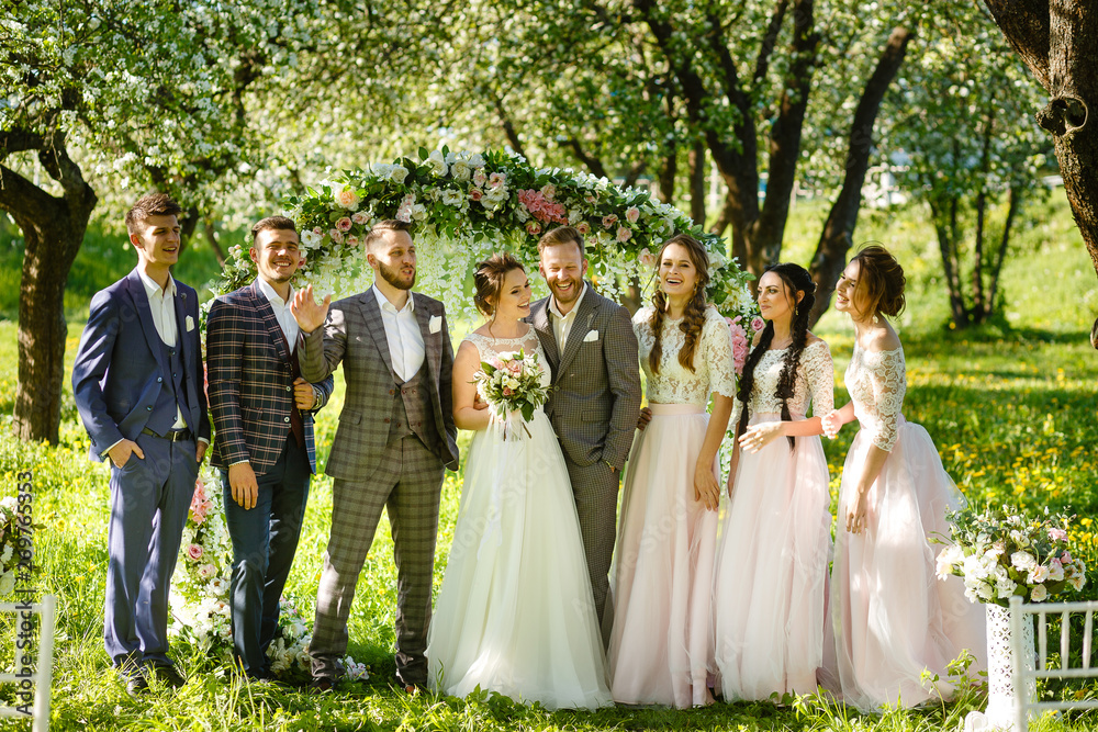Wedding ceremony in the apple orchard in spring