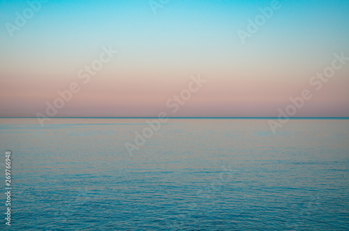 Seascape  view of sea horizon and colorful sky at sunset