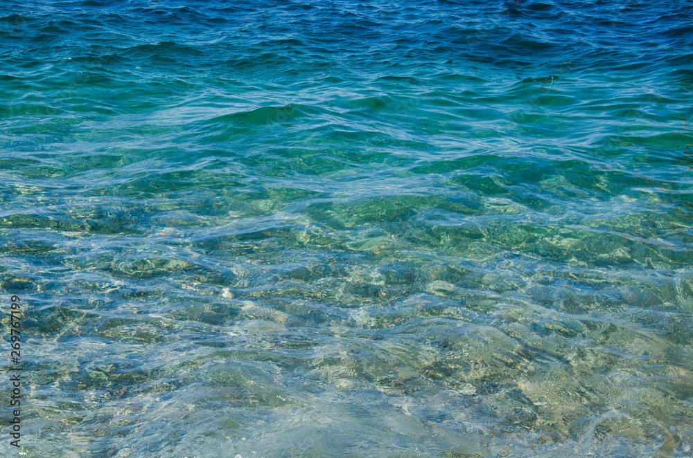 Fototapeta premium Abstract sea background, ripple surface of turquoise water