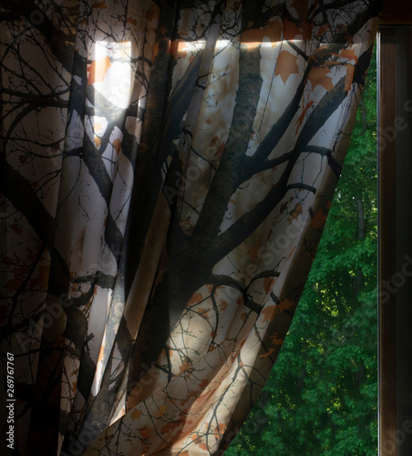 Tree-Patterned Curtain Partially Covering Window