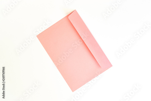 Beauty pink envelope; branding mock up; Top view on white background.