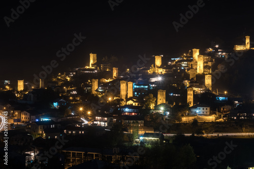 View of Svan towers with night illumination in Mestia village at night. Svaneti, Georgia © k_samurkas