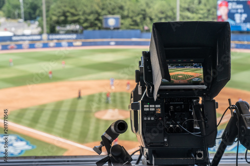 Photography Broadcast television camera shooting a baseball game on a sunny day
