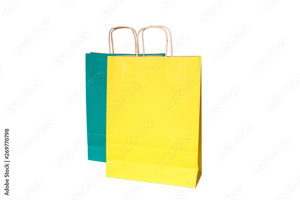 Yellow and green paper shopping bags isolated. Top view Yellow and green paper shopping bags isolated. Top view