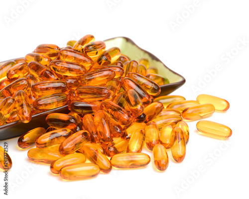 Vitamin Omega-3 fish oil capsules on white background photo