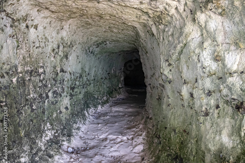 View inside a mountain cave at the sea.