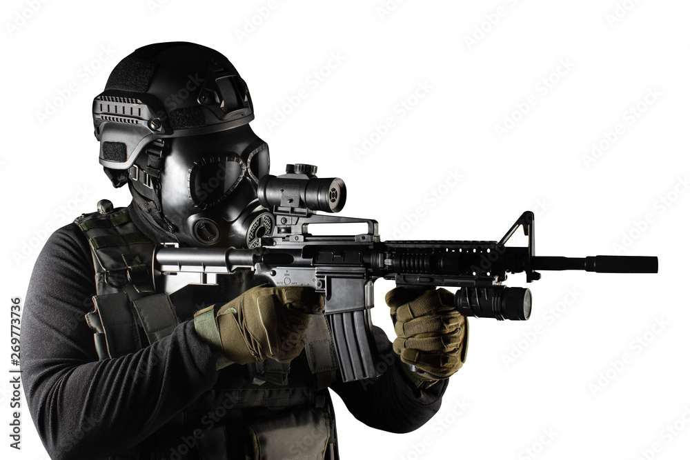 Isolated warrior soldier in gas mask and rifle aiming.