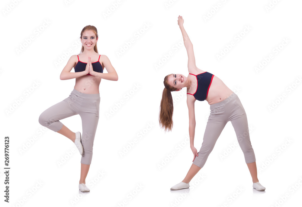 Obraz premium Young woman doing exercises on white