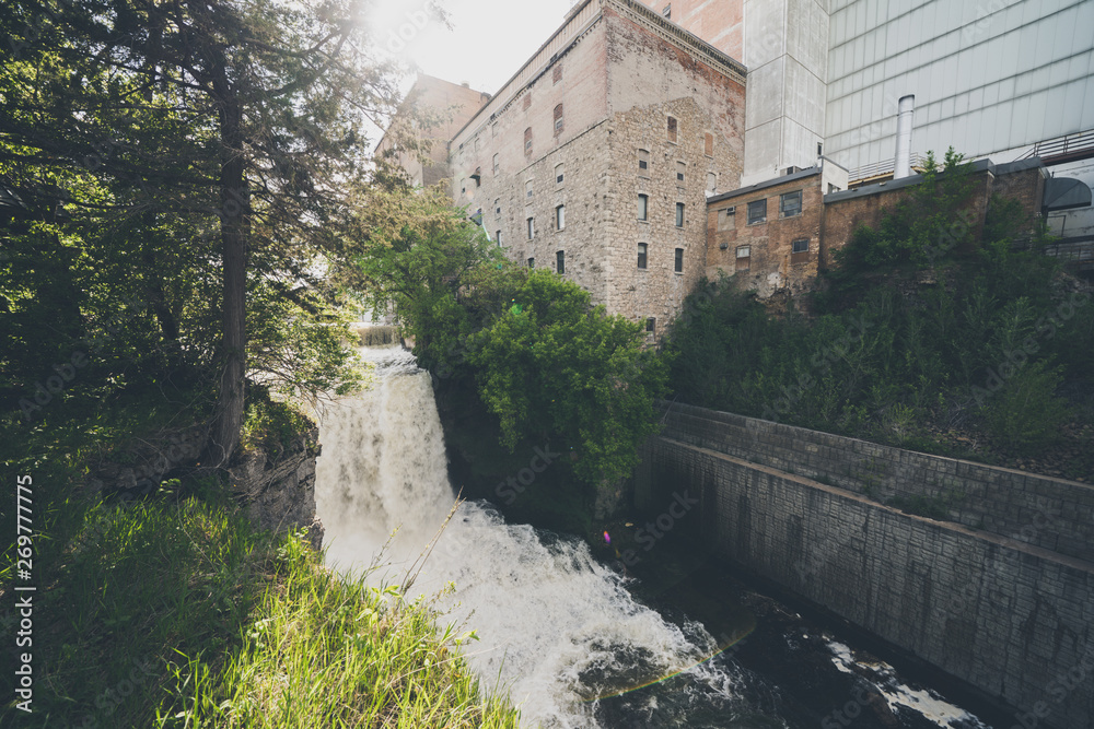 Vermillion Falls, an urban waterfall next to an old factory located in Hastings, Minnesota Vermillion Falls, an urban waterfall next to an old factory located in Hastings, Minnesota
