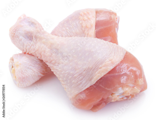 Raw chicken legs on white background photo