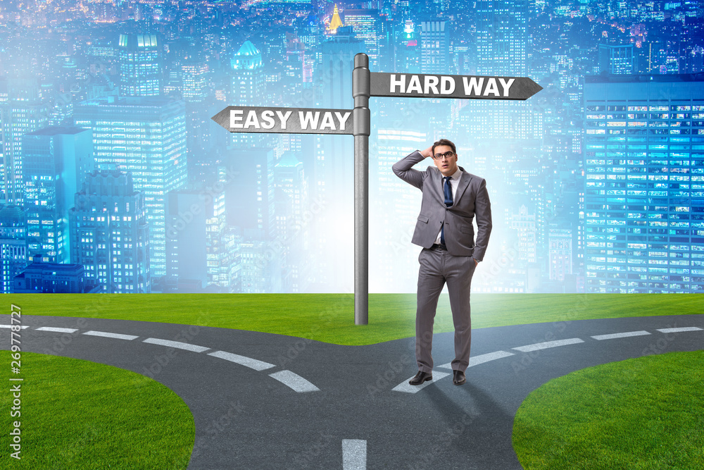 Businessman choosing between hard and easy way Businessman choosing between hard and easy way