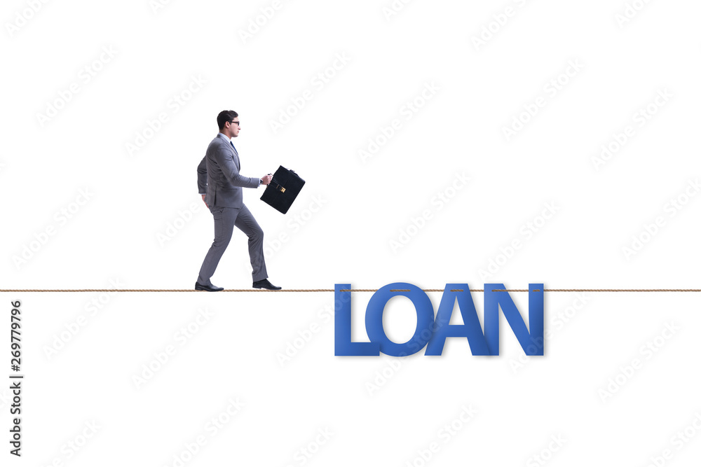 Debt and loan concept with businessman walking on tight rope Debt and loan concept with businessman walking on tight rope