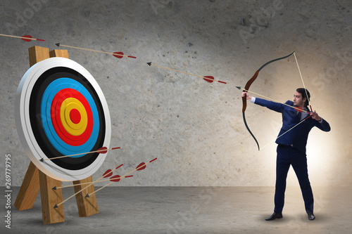 Photography Businessman aiming arrow with bow