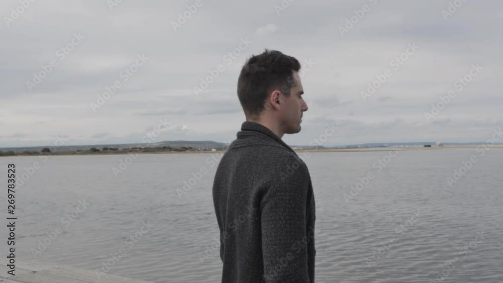 Man Deep breathing. Freedom Calm Man with beard in nature background. Blue ocean with cloudy sky. France 4K. Medium shot. Profile relaxation. Man Deep breathing. Freedom Calm Man with beard in nature background. Blue ocean with cloudy sky. France 4K. Medium shot. Profile relaxation.