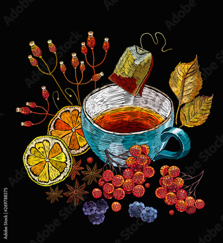 Embroidery cup of tea, mountain ash berries and lemons. Fashion autumn art. Template of clothes, tapestry, t-shirt design