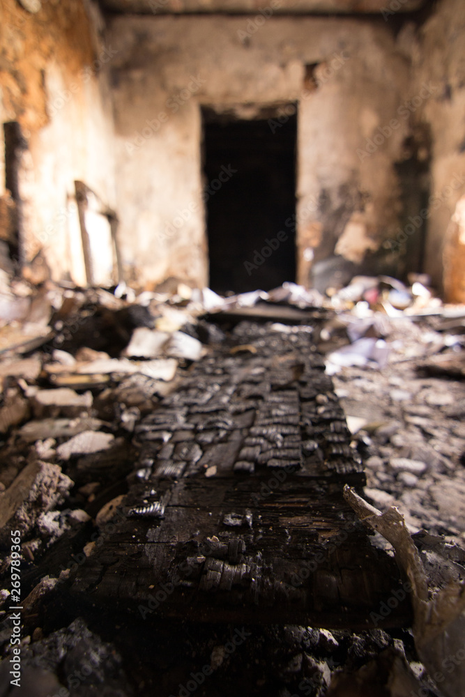 Burnt piece of wood and a door. Desolation Burnt piece of wood and a door. Desolation