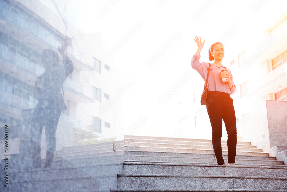 Positive young woman waving with hand Positive young woman waving with hand