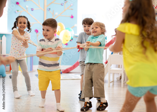 Group of kids play and pull...