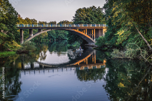 View of River Brda with bridge in Mecikal town in Pomerania region, Poland