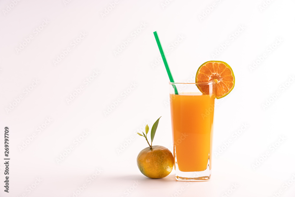 Fototapeta premium Pure orange juice no sugar, fresh from oranges fruit, healthy and refreshing drink in a glass with green straw. On isolated white background.