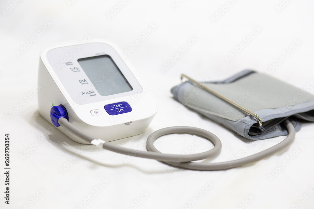 Woman checking accuracy blood pressure monitor,concept:Health care and Medical,Doctor Measuring patient arterial Woman checking accuracy blood pressure monitor,concept:Health care and Medical,Doctor Measuring patient arterial