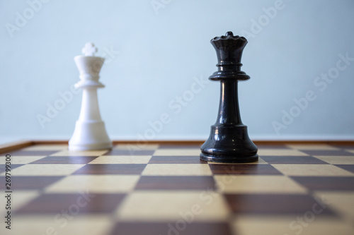 Chess placed on a wooden table,concept : of business strategy and tactic battle,symbol competition game success play victory war