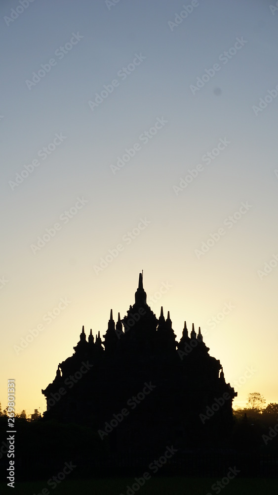 the beginning of summer when the sun rises with the foreground of a temple that looks very beautiful