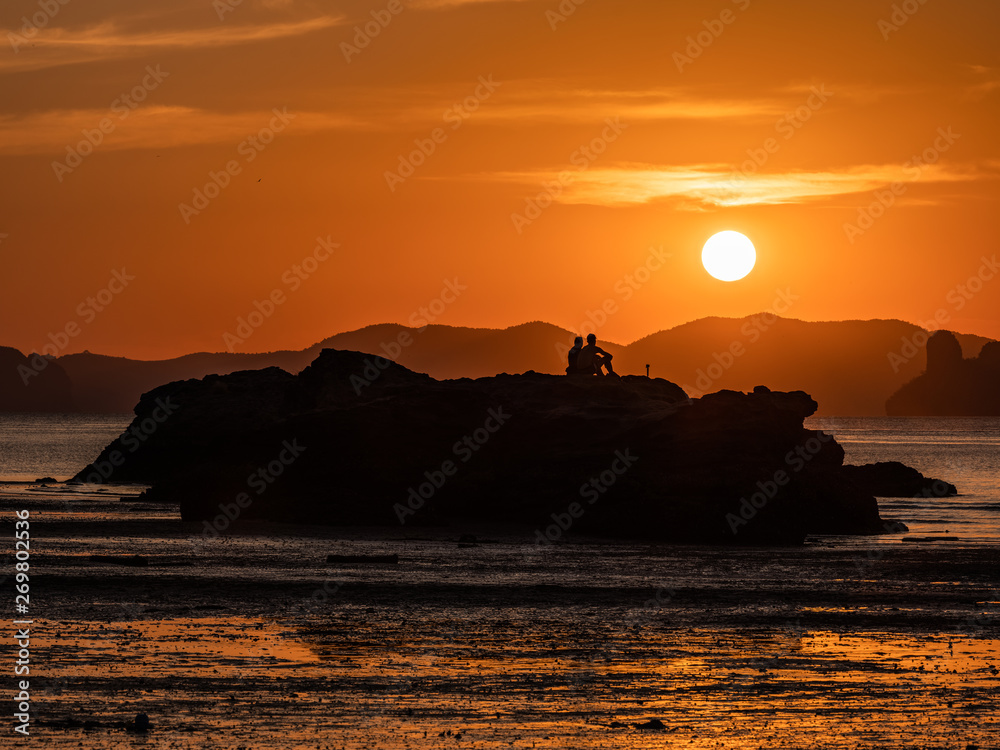 Silhuate couple with romantic sunset time