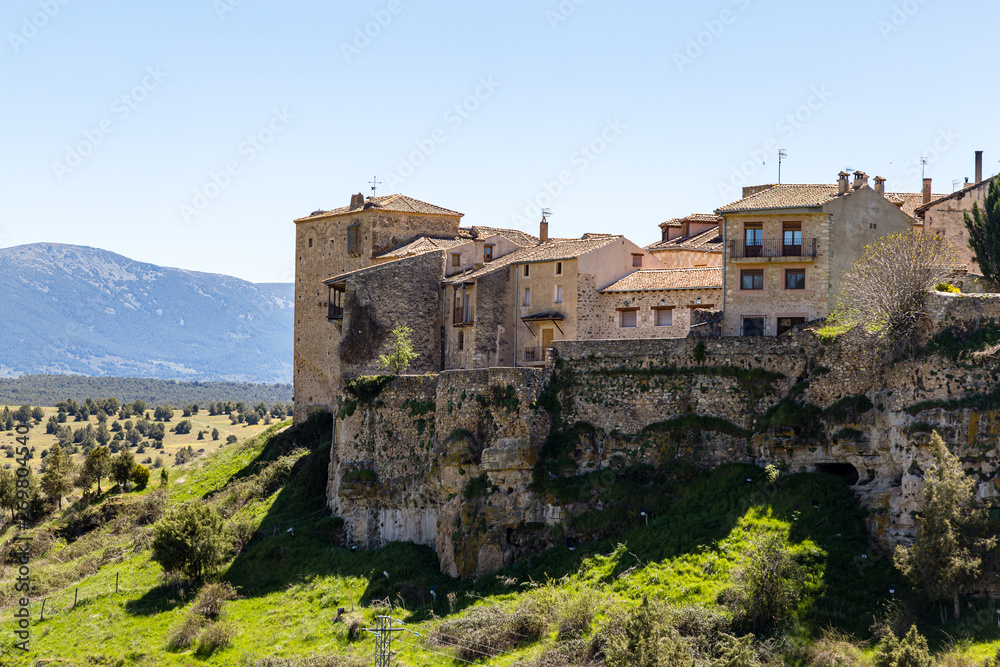 Pedraza, Castilla Y Leon, Spain: houses of Pedraza village from Mirador the Tungueras, with the Sierra de Guadarrama behind. Pedraza is one of the best preserved medieval villages of Spain