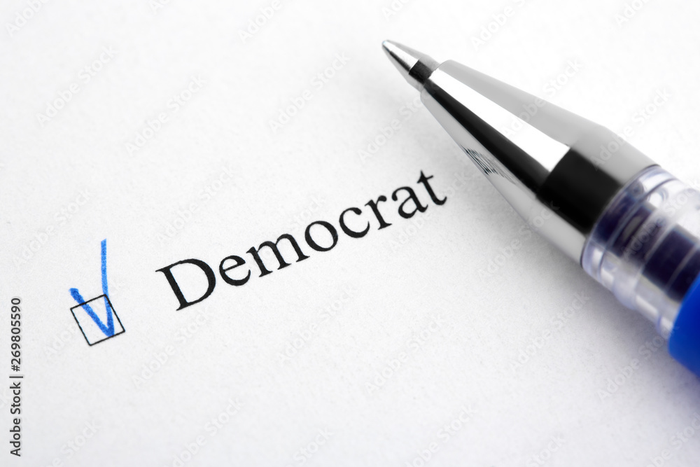 Democrat. Filling in the questionnaire, documents. The checkboxes are filled with a black pen on a white background. Questionnaire, survey.