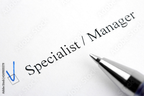 Specialist, Manager. Filling in the questionnaire, documents. The checkboxes are filled with a black pen on a white background. Questionnaire, survey.