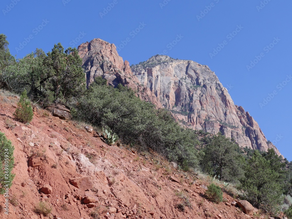 Upward shot of red mountains and sandstone cliffs at Zion National Park, Utah.