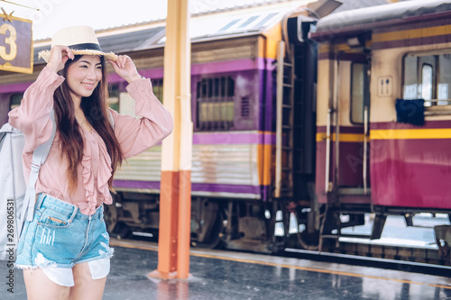 woman backpacker traveler with backpack at train station. journey trip travel concept