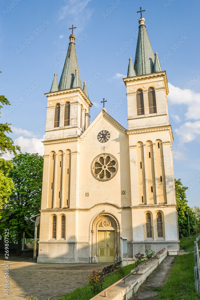Petrovaradin, Serbia - April 28, 2019:The main entrance to the Church of Our Lady of the Snows on Tekije