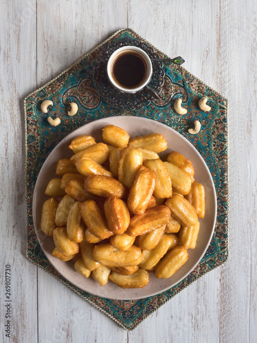 Ramadan sweets are laid out on the table. Top view photo