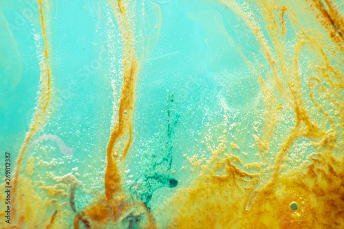 abstract texture. brown and aquamarine background. stains of watercolor paint in water