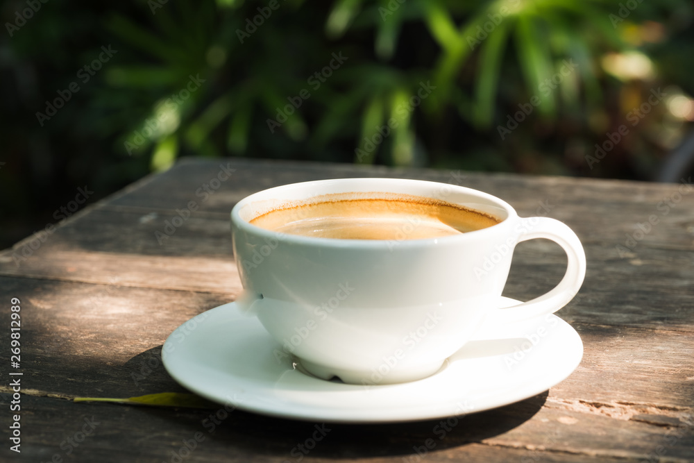 black coffee in white cup on wooden table. black coffee in white cup on wooden table.