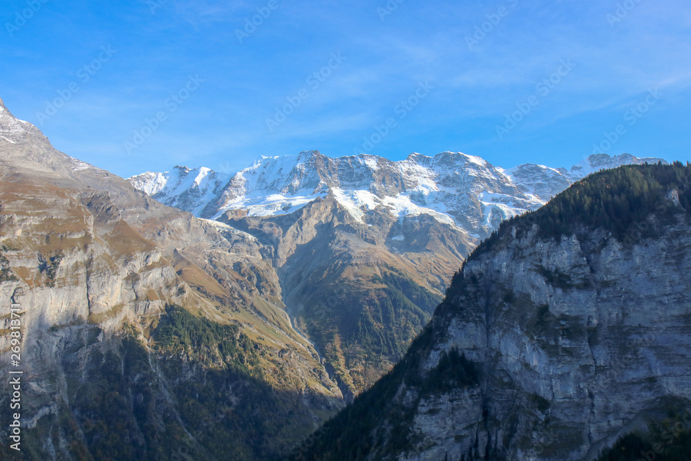 Morning view on Bernese range on beautiful village in mountain scenery, Grindelwald