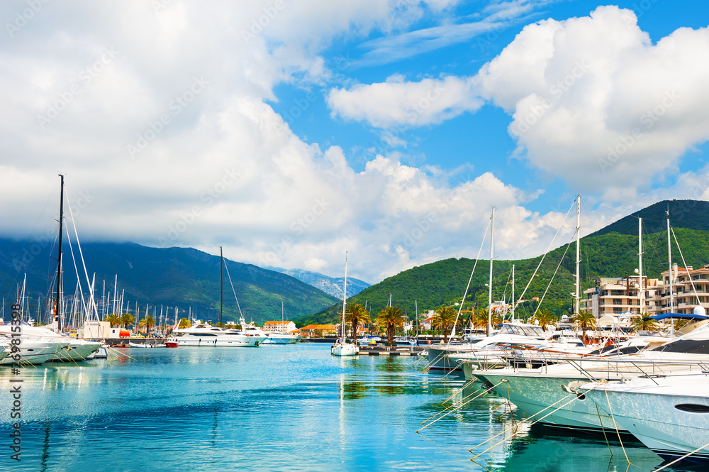 Yachts in the sea port of Tivat, Montenegro. Kotor bay, Adriatic sea. Famous travel destination.