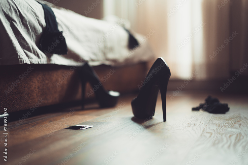 Bedroom mess with lingerie, shoes and stockings, quick sex concept. Sex  after a party, quick sex concept. Scattered clothes in the bedroom. high  heels in the foreground Stock Photo | Adobe Stock