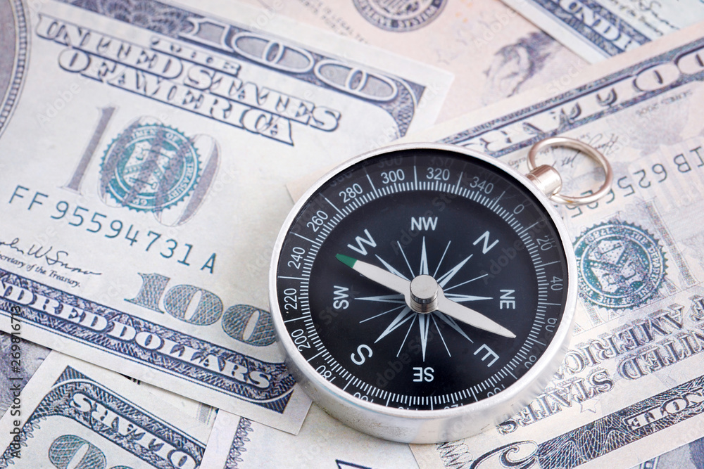 Financial Concept : US Dollar and Compass. Financial Concept : US Dollar and Compass.