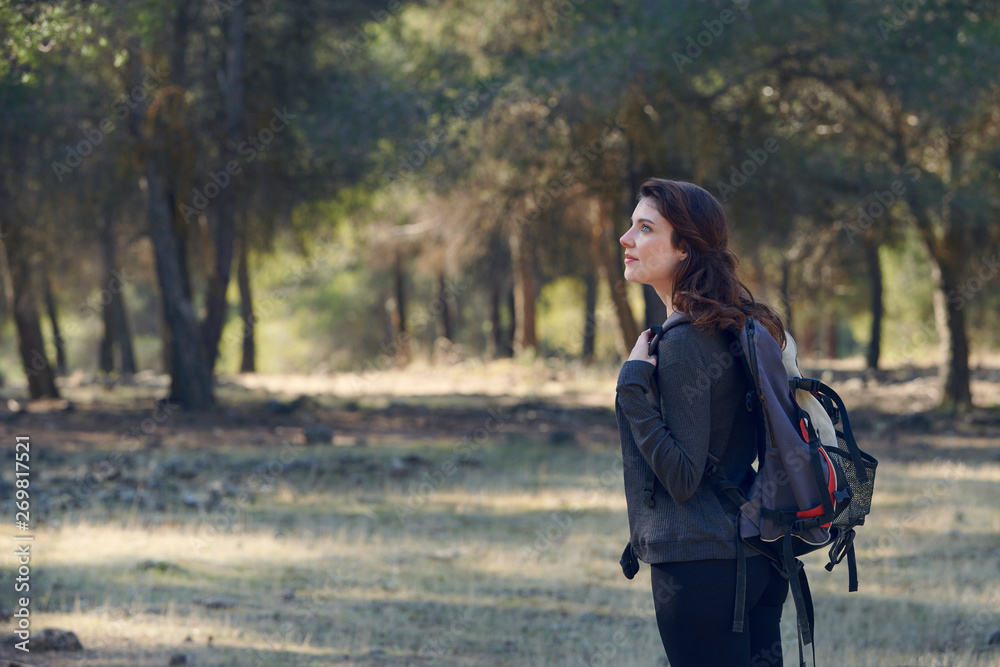 Photograph of a woman walking through the countryside, Granada, Spain. Photograph of a woman walking through the countryside, Granada, Spain.