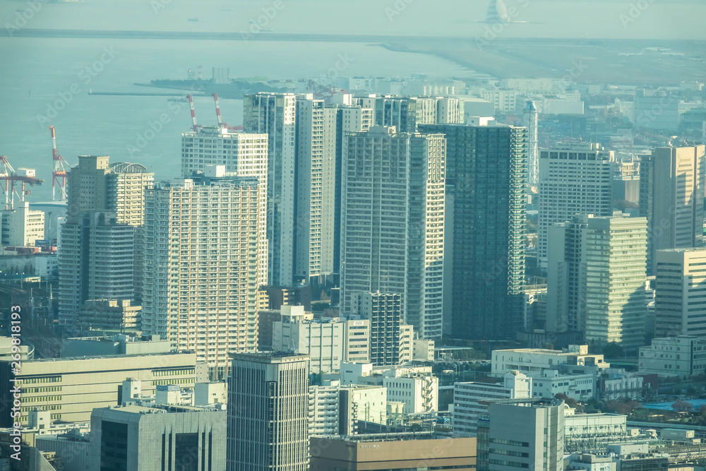 Naklejka premium Aerial View Of Tokyo City Buildings Against Cloudy Sky