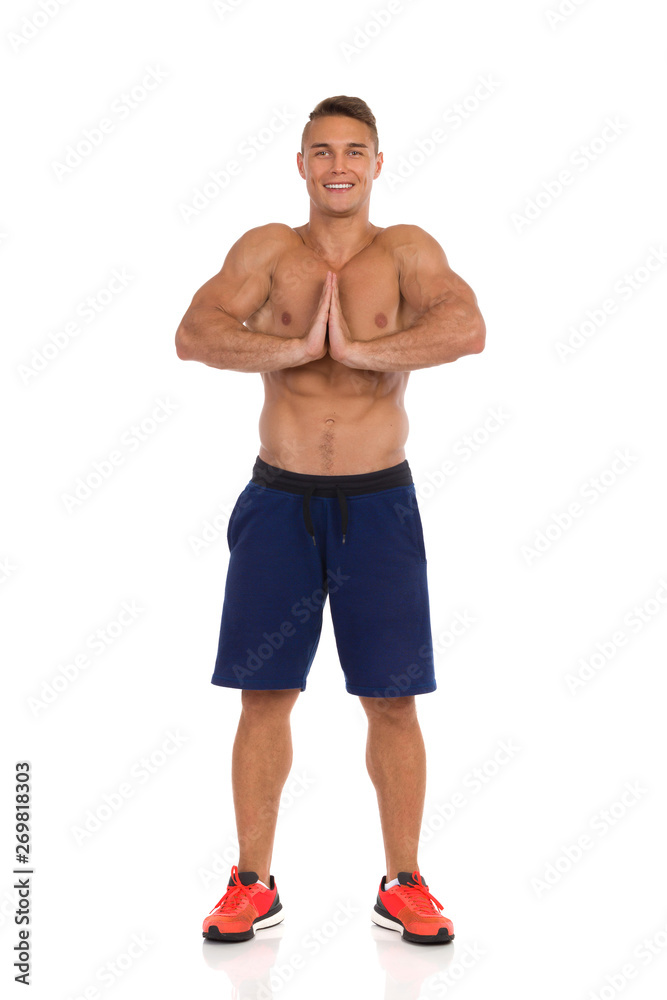 Young Fit Man Standing And Stretching. Young Fit Man Standing And Stretching.