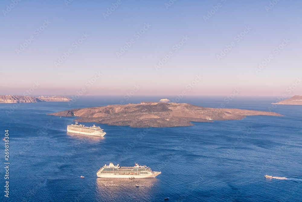 Cruise ship near volcano on island of Santorini
